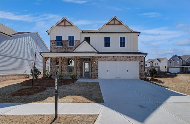 view of front of home featuring an attached garage, covered porch, brick siding, concrete driveway, and board and batten siding