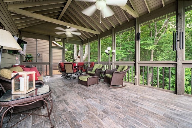 sunroom / solarium with ceiling fan and outdoor dining area