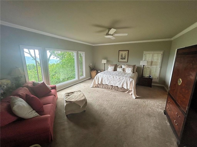 bedroom with crown molding, carpet, ceiling fan, and baseboards