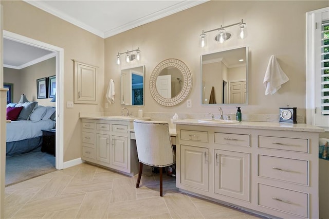 ensuite bathroom featuring vanity, crown molding, and baseboards
