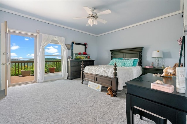 bedroom featuring carpet floors, access to exterior, crown molding, and ceiling fan