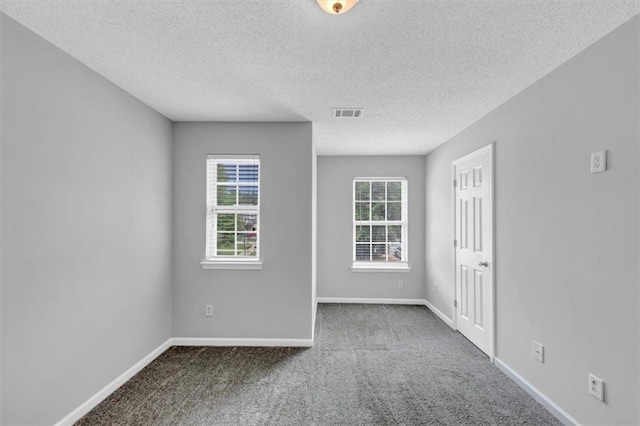2165 Capella Cir S, Fulton, GA 30331 - carpeted empty room featuring a textured ceiling and baseboards
