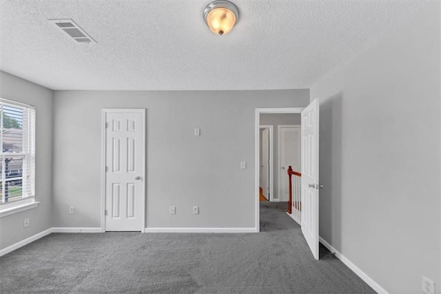 2165 Capella Cir S, Fulton, GA 30331 - unfurnished bedroom with a textured ceiling and carpet flooring