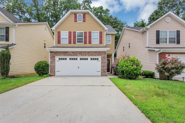 2165 Capella Cir S, Fulton, GA 30331 - traditional-style house featuring an attached garage, driveway, a front lawn, and stone siding