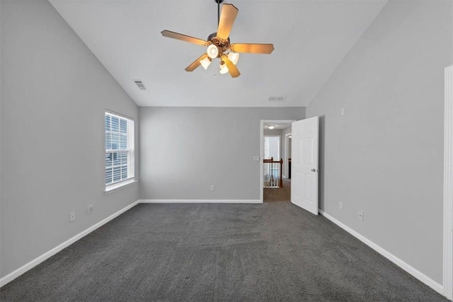 2165 Capella Cir S, Fulton, GA 30331 - spare room with lofted ceiling, dark colored carpet, and ceiling fan
