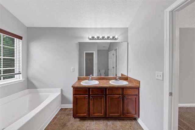 2165 Capella Cir S, Fulton, GA 30331 - full bath with a bath, healthy amount of natural light, double vanity, and a textured ceiling