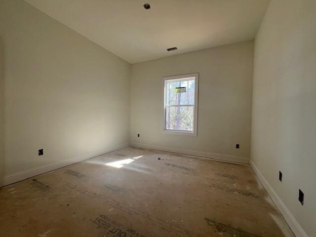 unfurnished room with visible vents and baseboards