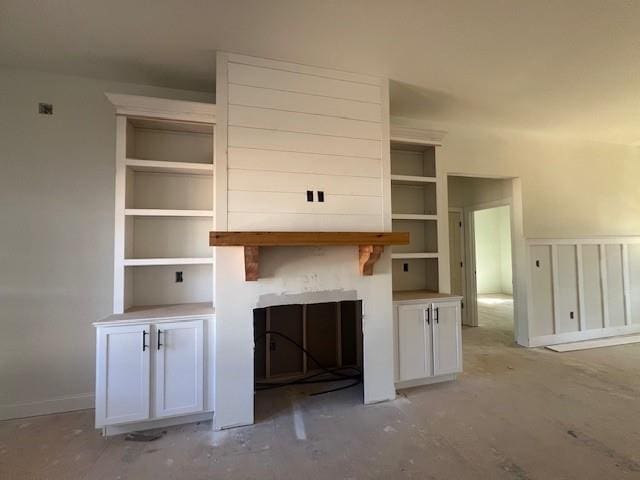 unfurnished living room featuring a fireplace