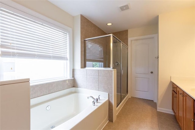 bathroom with vanity, separate shower and tub, and tile patterned floors