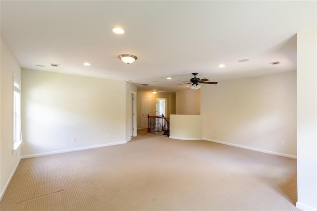 empty room featuring carpet and ceiling fan