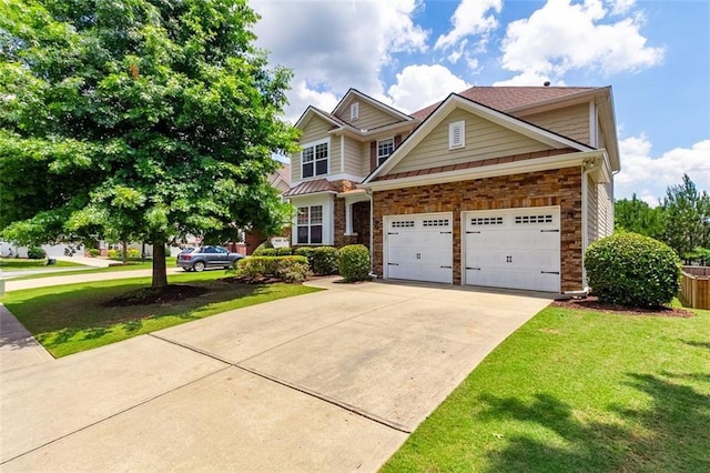 craftsman-style home with a garage and a front lawn