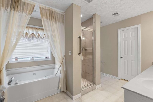 bathroom featuring a bath, a stall shower, visible vents, and tile patterned floors