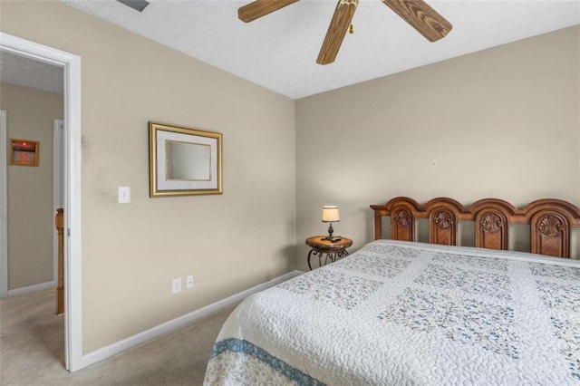 bedroom with ceiling fan, carpet flooring, and baseboards