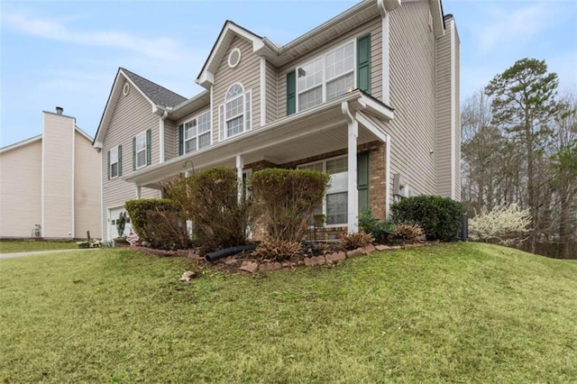 view of side of property featuring a yard