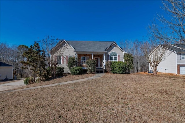 single story home featuring a porch and a front lawn