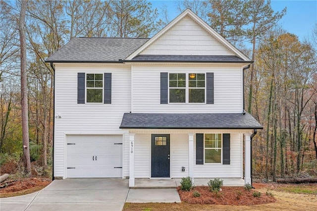 view of front of property featuring covered porch, concrete driveway, a shingled roof, and an attached garage