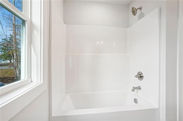 full bath featuring bathtub / shower combination and a wealth of natural light