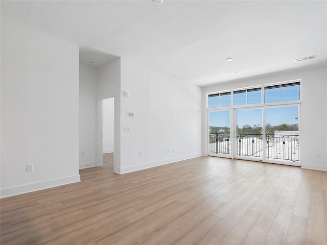 675 Drewry St NE Unit 205, Atlanta, GA 30306 - spare room featuring light wood-style floors and baseboards