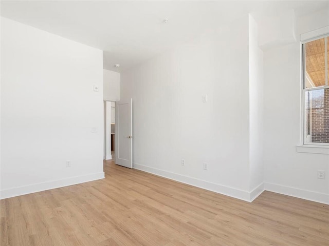 675 Drewry St NE Unit 205, Atlanta, GA 30306 - spare room featuring light wood-style floors and baseboards