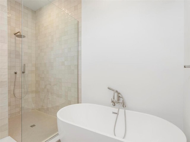675 Drewry St NE Unit 205, Atlanta, GA 30306 - bathroom with a tile shower and a soaking tub
