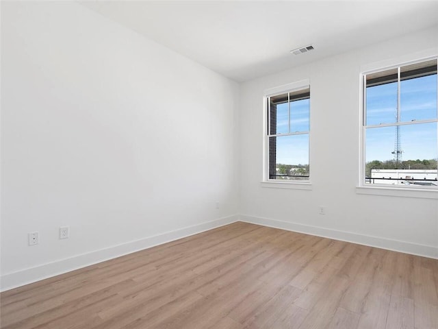 675 Drewry St NE Unit 205, Atlanta, GA 30306 - spare room featuring light wood-style flooring and baseboards