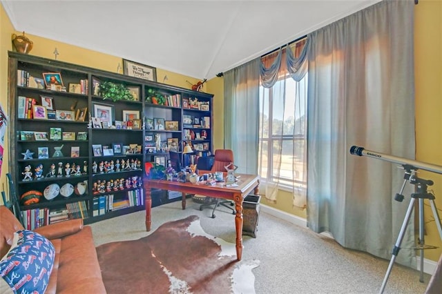 office space featuring lofted ceiling, carpet, and baseboards