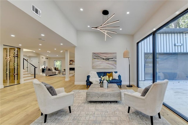 living room featuring hardwood / wood-style flooring and a chandelier