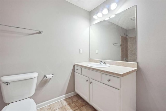 bathroom with toilet and vanity