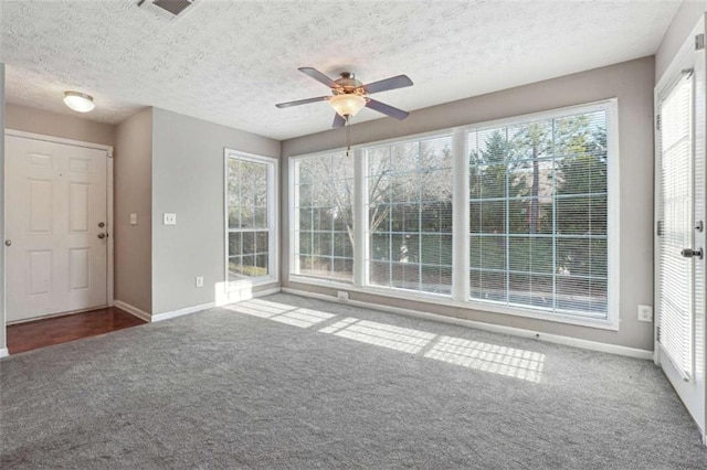 interior space with ceiling fan