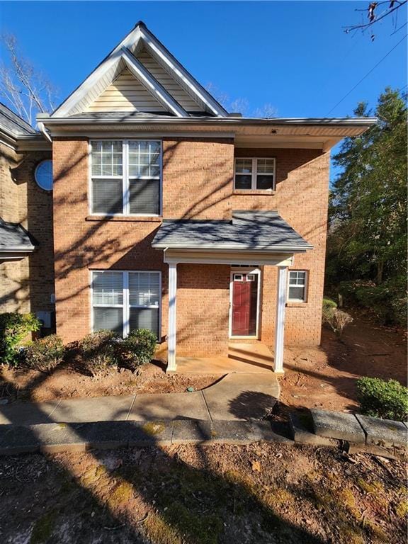 view of front of house featuring brick siding