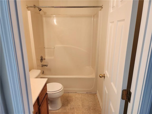 bathroom with tub / shower combination, vanity, and toilet