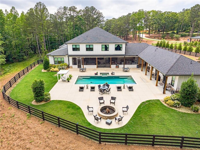 6301 New Bethany Rd, Buford, GA 30518 - view of pool with a fire pit, a sunroom, outdoor dining space, a patio area, and a pool with connected hot tub