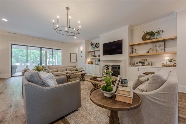 6301 New Bethany Rd, Buford, GA 30518 - living room with ornamental molding, a glass covered fireplace, a chandelier, light wood-style flooring, and recessed lighting