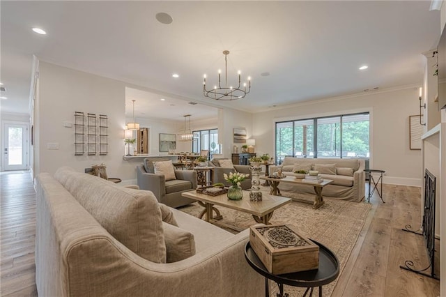 6301 New Bethany Rd, Buford, GA 30518 - living area with a chandelier, healthy amount of natural light, recessed lighting, light wood-style flooring, and crown molding