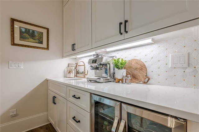 6301 New Bethany Rd, Buford, GA 30518 - bar featuring beverage cooler, a sink, decorative backsplash, and baseboards