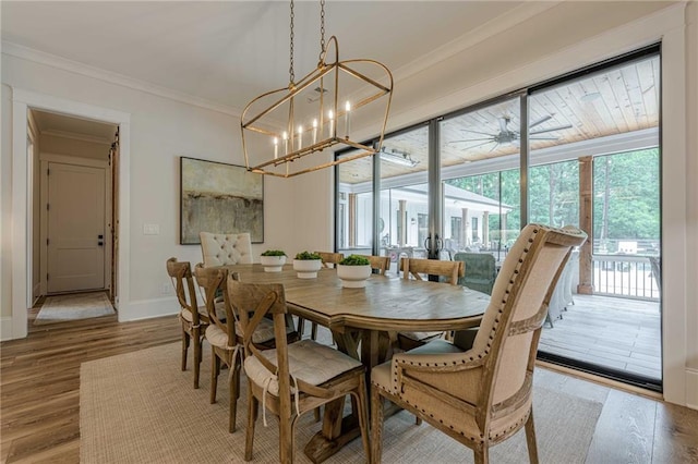 6301 New Bethany Rd, Buford, GA 30518 - dining room with wood finished floors, crown molding, a chandelier, and baseboards