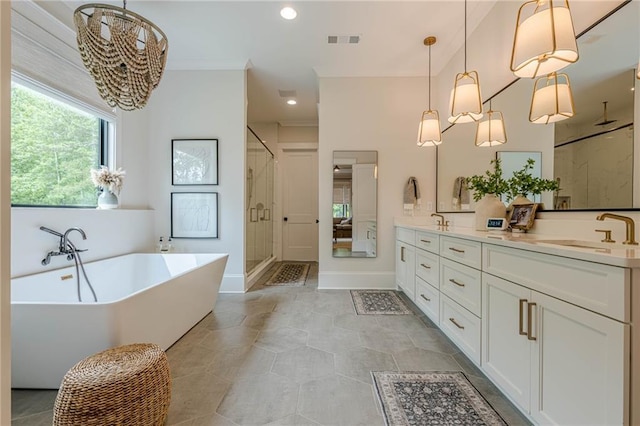 6301 New Bethany Rd, Buford, GA 30518 - full bath with a stall shower, double vanity, a soaking tub, a chandelier, and baseboards