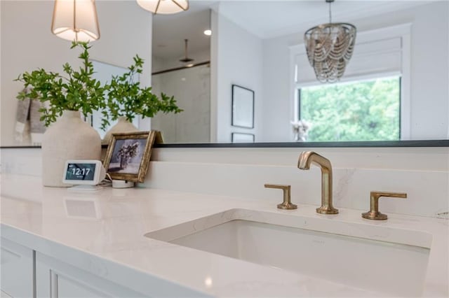 6301 New Bethany Rd, Buford, GA 30518 - detailed view of double vanity, a shower, and a chandelier