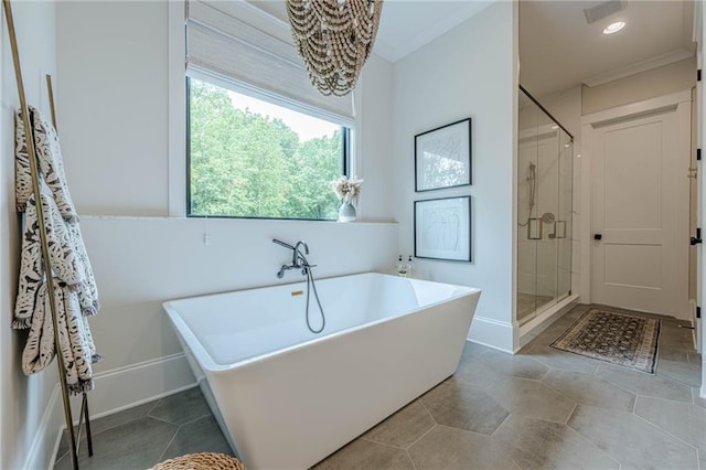6301 New Bethany Rd, Buford, GA 30518 - full bathroom with a chandelier, a soaking tub, a shower stall, baseboards, and crown molding