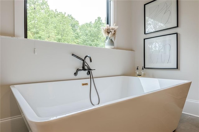 6301 New Bethany Rd, Buford, GA 30518 - full bath featuring a soaking tub, plenty of natural light, and baseboards