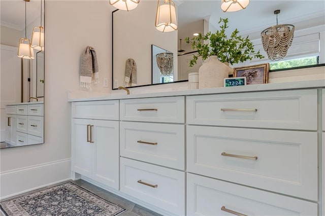 6301 New Bethany Rd, Buford, GA 30518 - full bathroom with double vanity, baseboards, ornamental molding, and tile patterned flooring