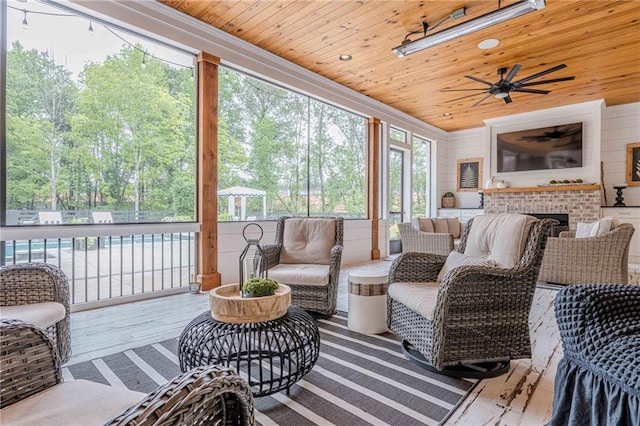 6301 New Bethany Rd, Buford, GA 30518 - sunroom / solarium with an outdoor living space with a fireplace, ceiling fan, and view of scattered trees