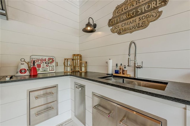 6301 New Bethany Rd, Buford, GA 30518 - kitchen with a sink, white cabinetry, and dark countertops