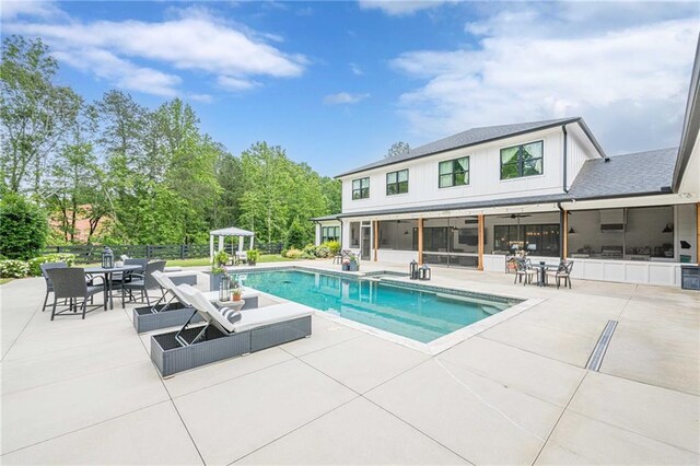 6301 New Bethany Rd, Buford, GA 30518 - outdoor pool featuring a patio, a ceiling fan, outdoor dining space, and a sunroom