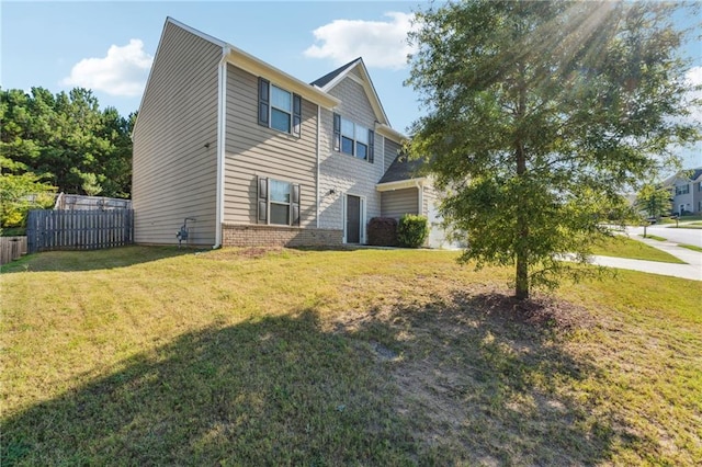 view of side of property with a lawn