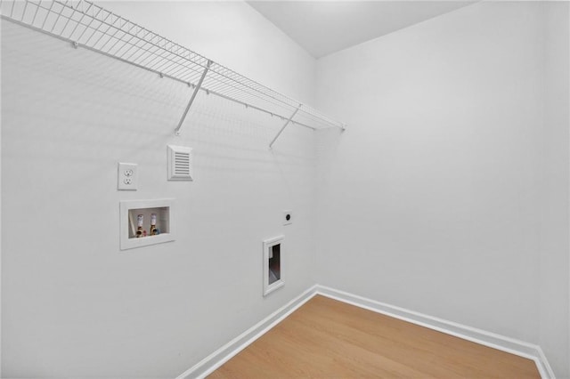 laundry area with hookup for an electric dryer, washer hookup, and hardwood / wood-style flooring