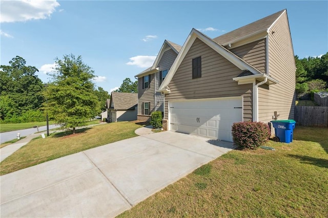 view of side of property with a garage and a yard