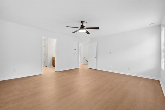 spare room featuring ceiling fan and light hardwood / wood-style flooring