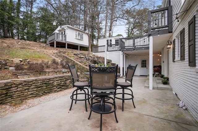 view of patio / terrace featuring a balcony