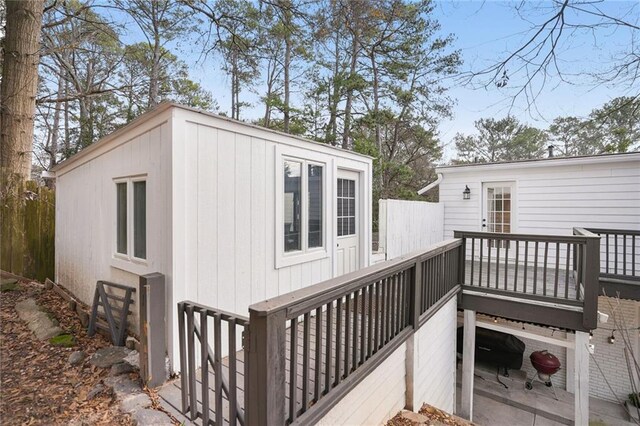 rear view of property with a wooden deck